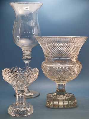 Lot 399 - A cut glass thistle shaped vase on a square...