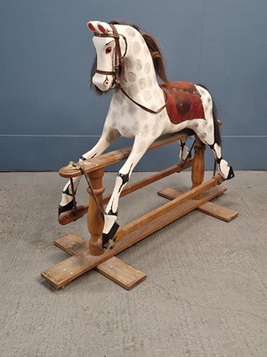 Lot 404 - A harnessed black and white horse rocking on a...