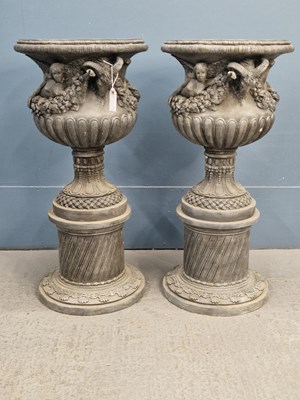 Lot 411 - A pair of spelter garden urns on spirally...