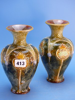 Lot 413 - A pair of Doulton stoneware baluster vases...