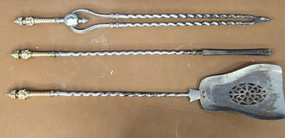 Lot 416 - A set of three fire irons with fire dogs, the...