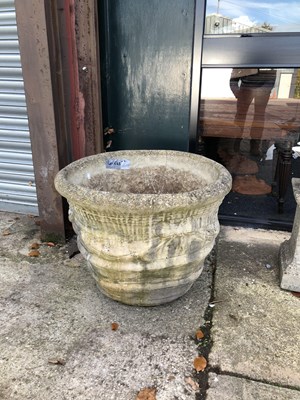 Lot 643 - A pair of large stone urns with a decorative...