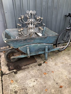 Lot 644 - A wooden wheelbarrow, together with four...