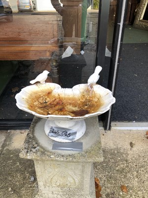 Lot 645 - A metal birdbath painted in white