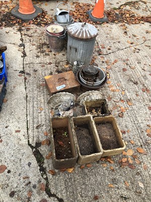 Lot 648 - A collection of plant holders, sculptures, and...