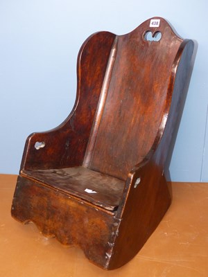 Lot 438 - A child's mahogany wing backed commode rocking...