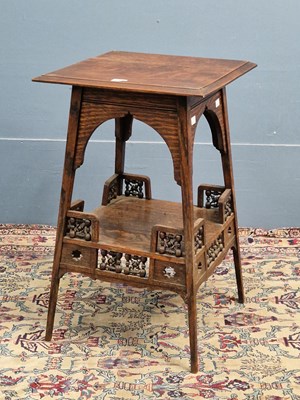 Lot 441 - A Liberty & Co oak Egyptian taste two tier...