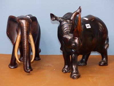 Lot 447 - An ebony carving of an elephant together with...