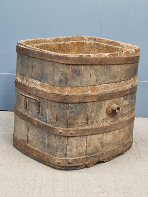 Lot 448 - An iron coopered pine wood basket, the rounded...