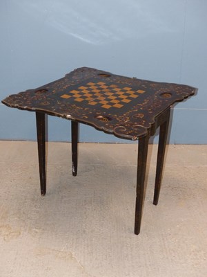 Lot 454 - An antique Chinese export lacquer games table,...