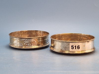 Lot 516 - A pair of silver wine coasters, London 1977