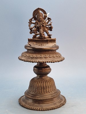 Lot 545 - An Indian bronze votive oil lamp, the...