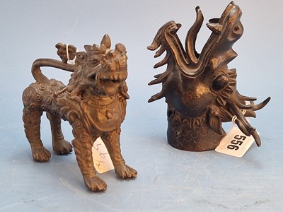 Lot 556 - A Chinese bronze dragon head shaft...