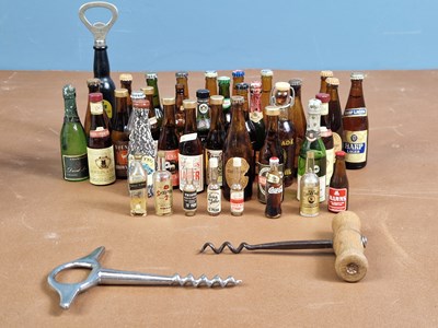 Lot 485 - Miniature beer bottles. a collection of 8-9cm...