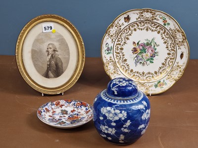 Lot 579 - A Sevres plate later painted with flowers and...