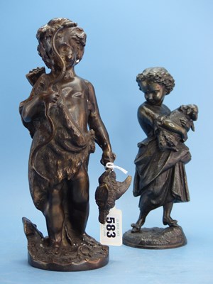 Lot 583 - A bronze figure of a child bowman with a game...