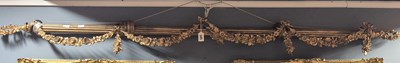 Lot 585 - A gilt metal curtain rail swagged with floral...