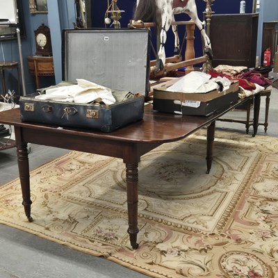 Lot 591 - A Regency mahogany rounded rectangular dining...