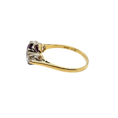Lot 8 - An 18ct hallmarked gold purple sapphire and...