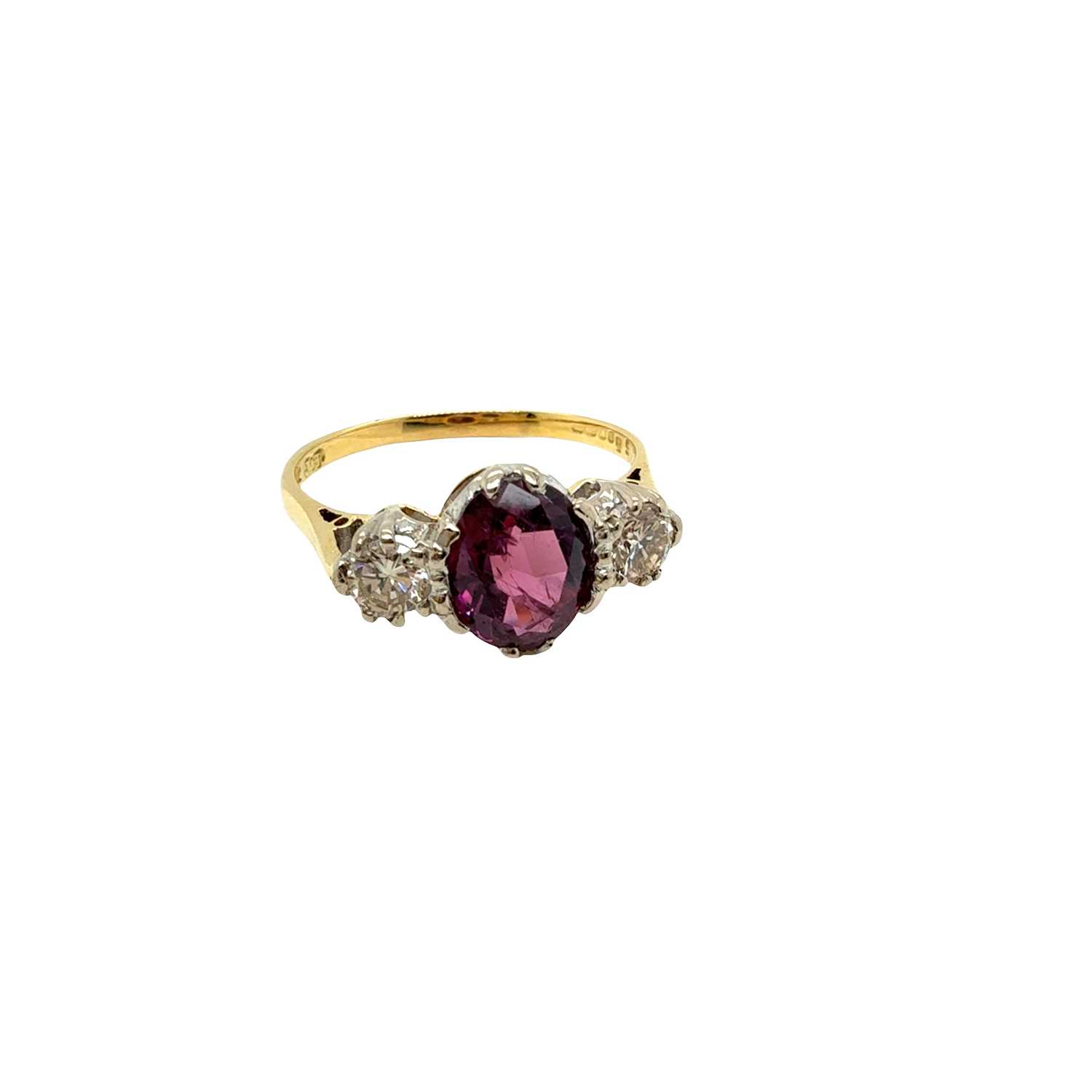Lot 8 - An 18ct hallmarked gold purple sapphire and...