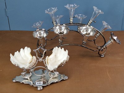 Lot 595 - An electroplate stand supporting two exotic...