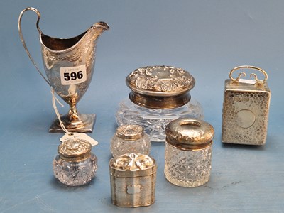 Lot 596 - A George III silver helmet shaped cream jug,...