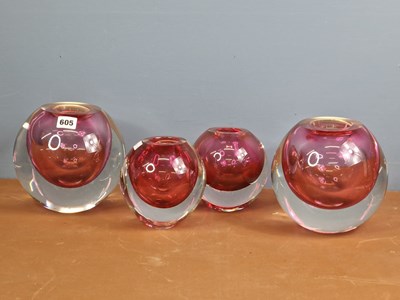 Lot 605 - A pair and two other spherical clear glass...