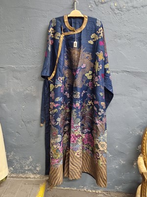 Lot 606 - A Chinese blue ground silk four claw dragon...