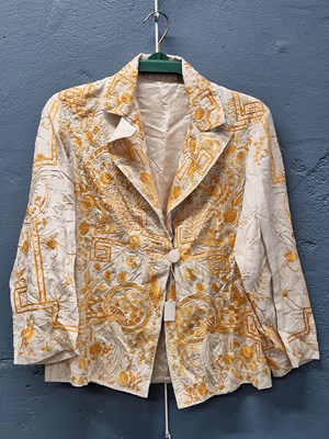 Lot 608 - A Chinese white silk jacket embroidered in...