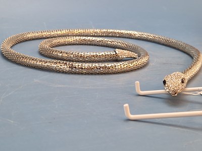 Lot 630 - A silvered metal flexible snake form belt, the...