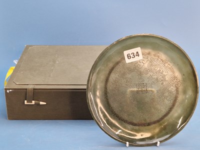 Lot 634 - A boxed Chinese greenstone plate incised with...