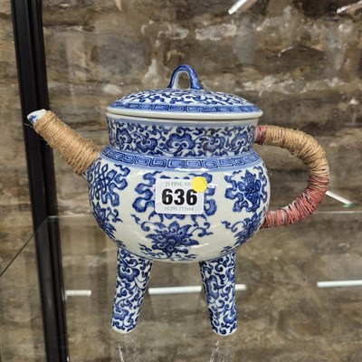 Lot 636 - A Chinese blue and white tea pot on four legs...