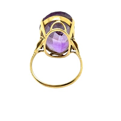 Lot 26 - Cocktail ring. A mid-century oval gemset...