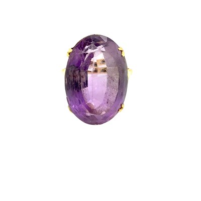 Lot 26 - Cocktail ring. A mid-century oval gemset...