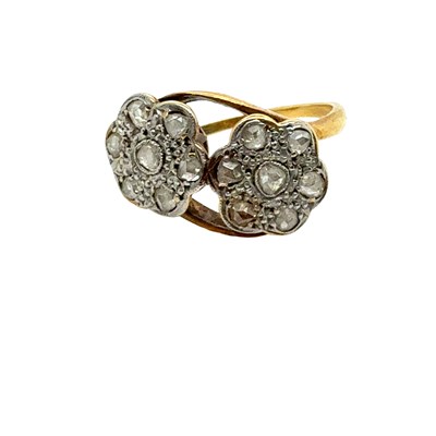 Lot 31 - An antique ring set with two old-cut diamond...