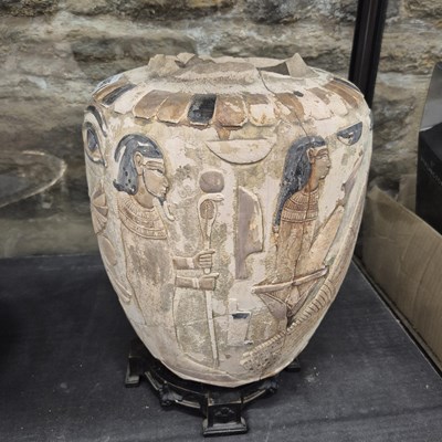 Lot 645 - A terracotta vase decorated in relief  with...