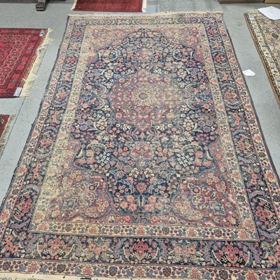 Lot 493 - An antique Persian Tabriz carpet 313 x 192 cm