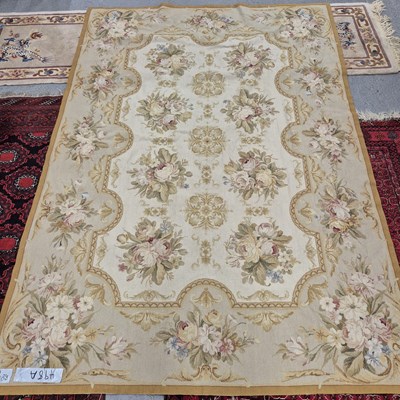 Lot 498a - A needlepoint rug of floral design