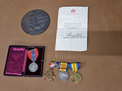 Lot 248 - A WWI  Mon Star 1914 medal Group of three to...