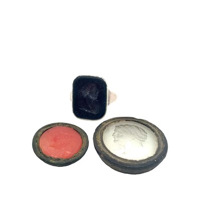 Lot 63 - An early carved red stone intaglio seal set...