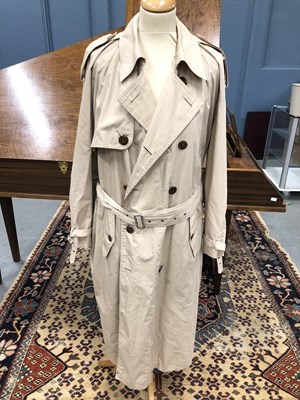 Lot 130 - A cream Yves Saint Laurent raincoat, size 36/48