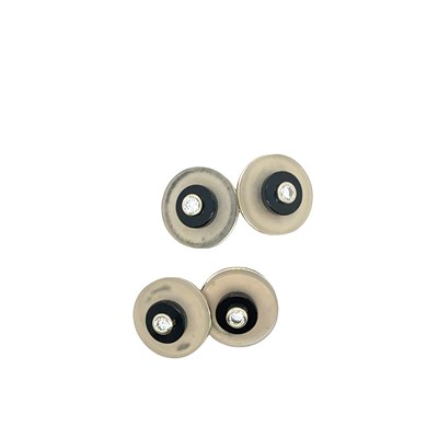 Lot 45 - A pair of platinum onyx and diamond cufflinks...