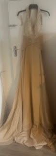 Lot 107 - Cream evening dress, Size 10 Proceeds from...