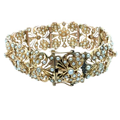 Lot 47 - A Vintage articulated seed pearl set floral...