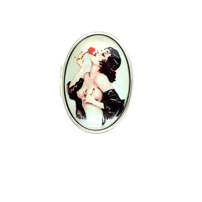 Lot 84 - A silver oval hinged box with a risque enamel...