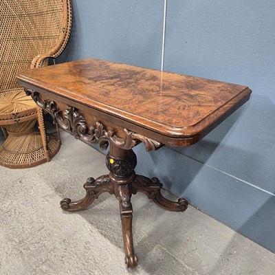Lot 612a - A Victorian walnut fold-over card table on a...