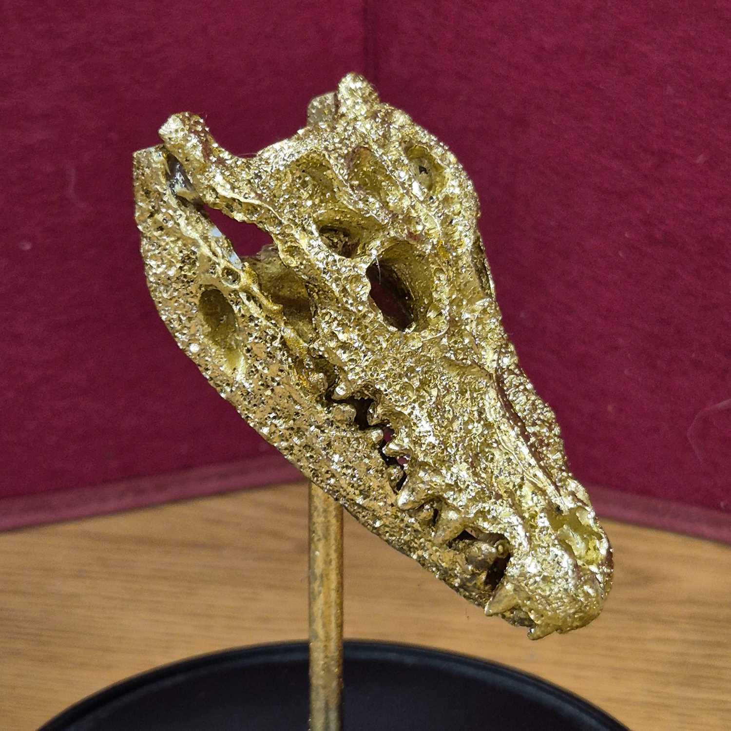 Lot 95 - A decorative sculpture of a gilded alligator...