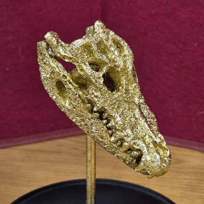 Lot 95 - A decorative sculpture of a gilded alligator...