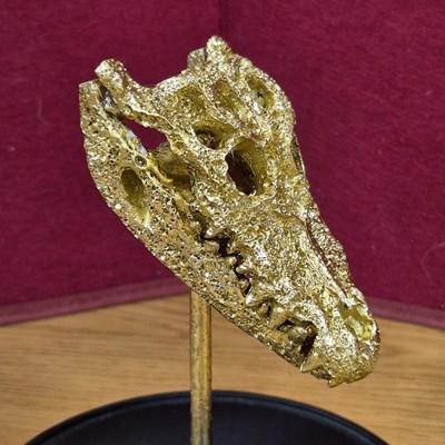 Lot 95 - A decorative sculpture of a gilded alligator...