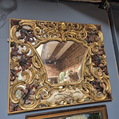 Lot 232 - An Italian gilt wood angel head crested framed...
